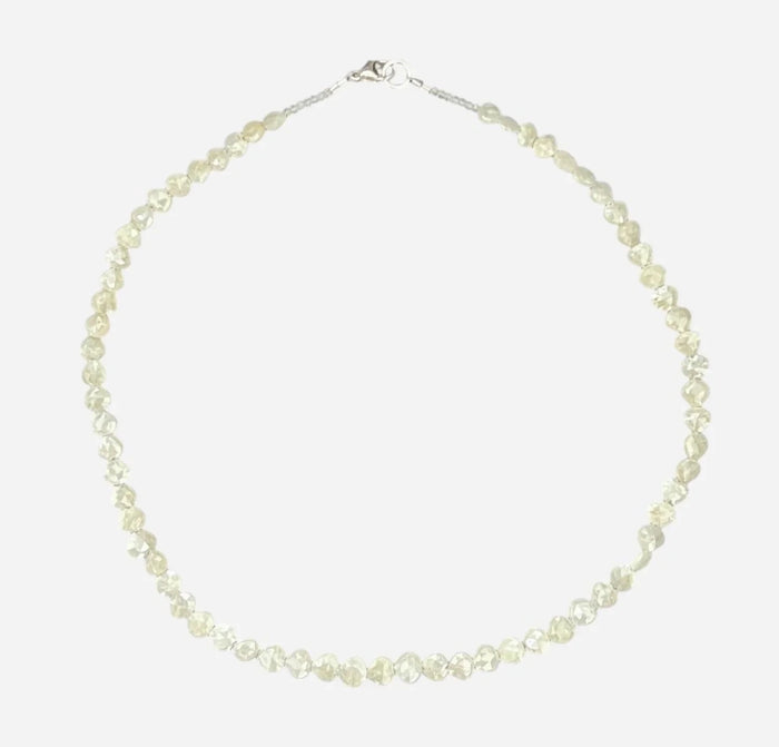 The ANN LIGHTFOOT Faceted Sillimanite and Quartz Ras du Cou Necklace features small, translucent pale yellow gemstones in an irregular single strand with a sterling silver clasp.