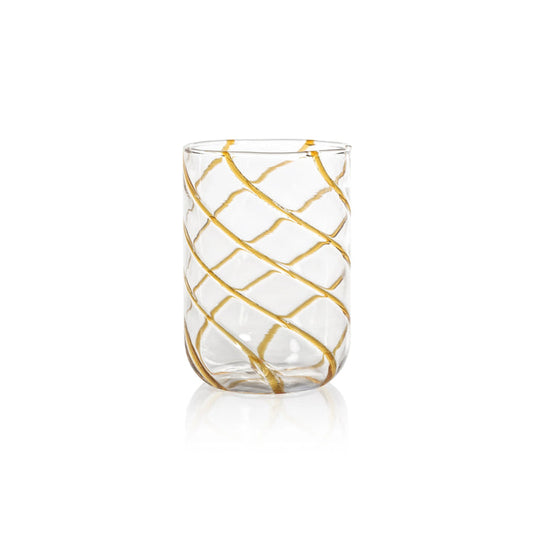 The AMBER SWIRL GLASS TUMBLER by ZODAX, a clear cylindrical glass adorned with bold gold diagonal swirl stripes, is elegantly displayed on a white background.