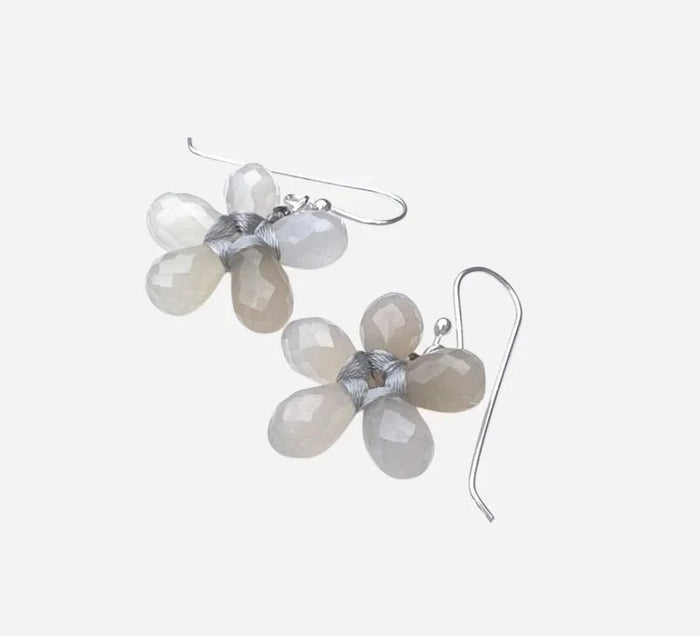 The ANN LIGHTFOOT Faceted Grey Onyx Glower Earrings feature blossom-inspired designs with five translucent, teardrop-shaped grey onyx petals and sterling silver hooks. The image background is plain white.