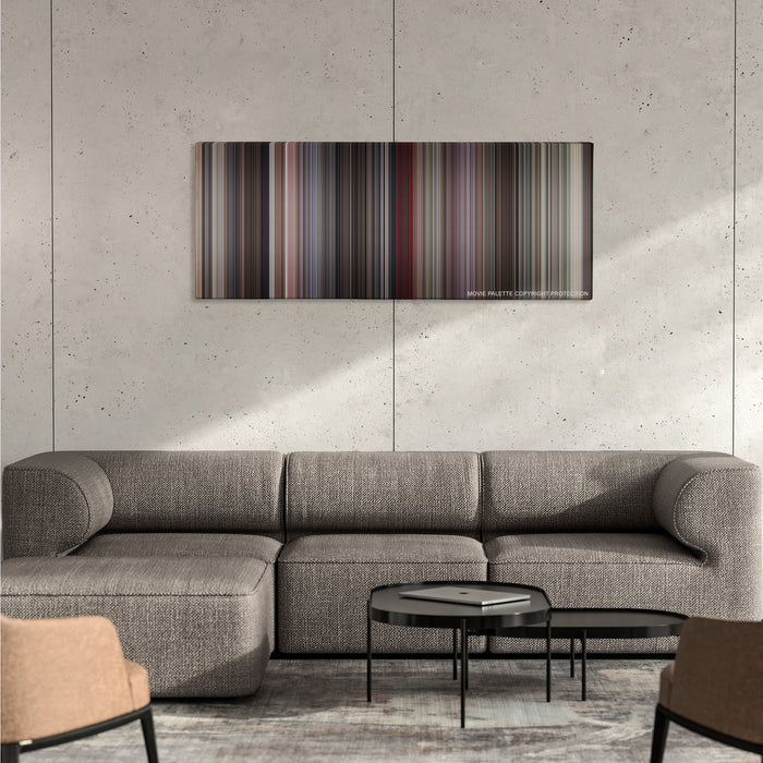 Beverly Hills Cop color palette canvas on a concrete wall above a gray sectional sofa