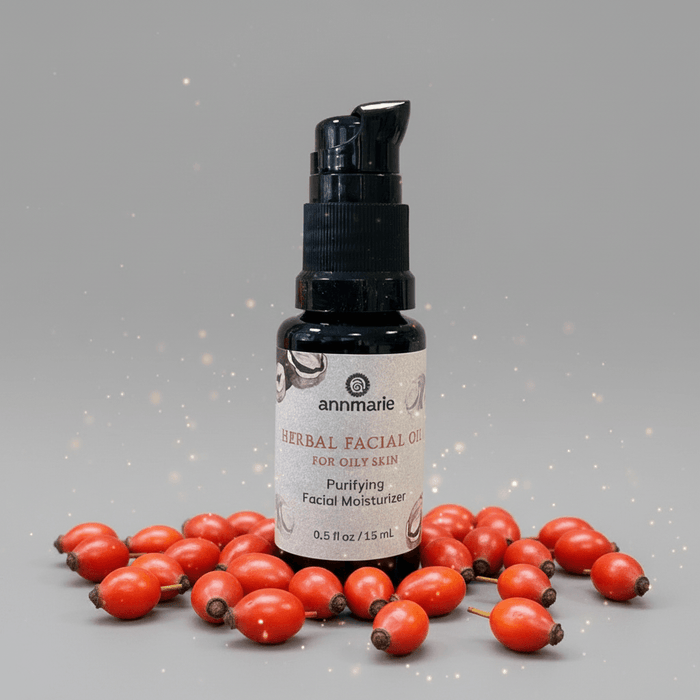 Bottle of annmarie herbal facial oil with rosehips on a gray background