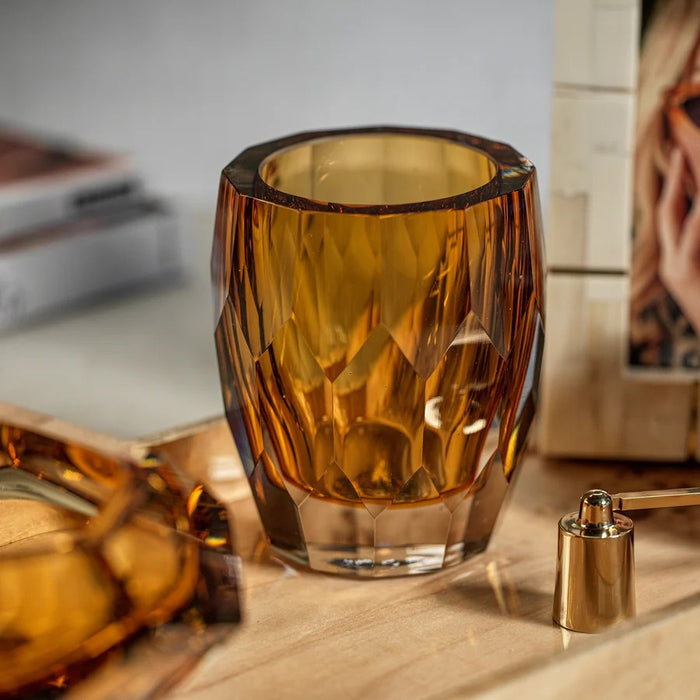 ZODAX LA BOHEME Handmade Polished Cut Glass Vase / Hurricane in amber, showcased on a white background. This vase features geometric facets inspired by the La Bohème collection, with a clear base and striking angular design that produces a captivating reflective surface.